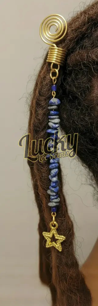 Decorative charm with spiral, star, and blue accents