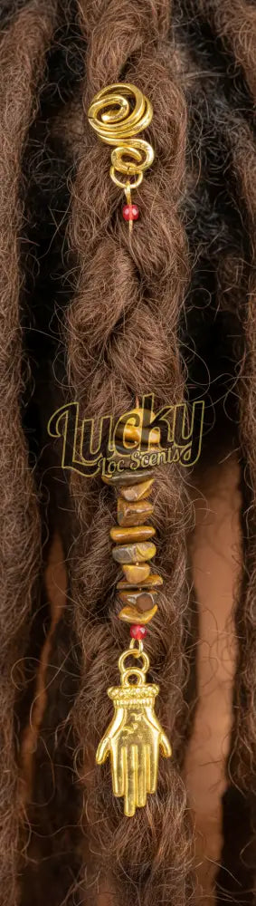 Decorative pendant with beads and a gold hand charm