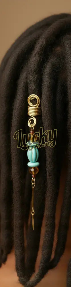 Decorative beaded charm with gold element