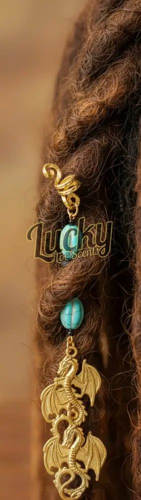 Gold dragon charm with turquoise stones