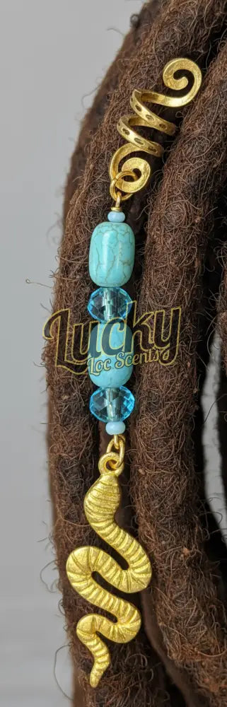 Gold snake-shaped pendant with turquoise beads