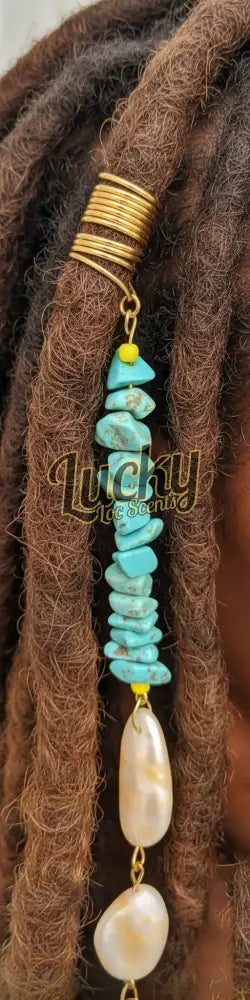 Turquoise stone pendant with gold and yellow accents