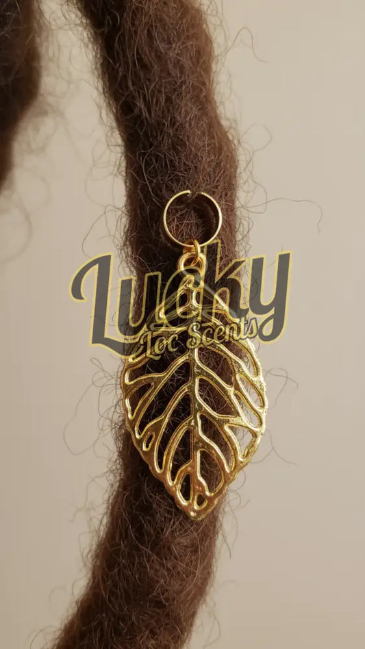 Gold leaf-shaped charm 