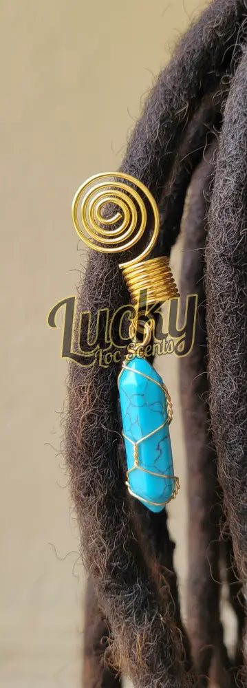 Gold and turquoise stone charm